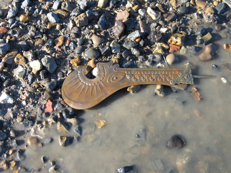 Artifact on river bed at low tide.