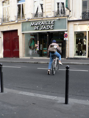 I want to ride around on a  bicycle with a baguette in my backpack in Paris!