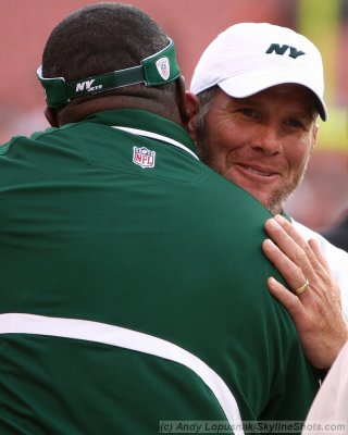 New York Jets QB Brett Favre gets a hug from Jets assistant defensive line coach Bryan Cox