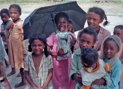 Children under Umbrella.