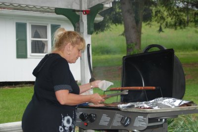 Joyce cooking for the rehearsal dinner
