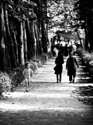 Boy walking in park - Tehran