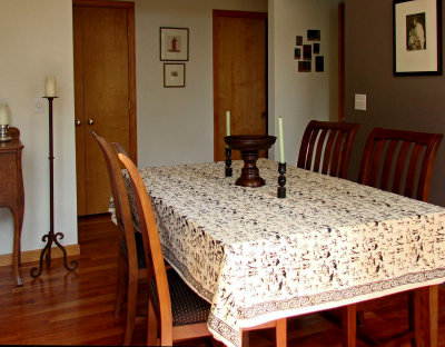 dining room into central hallway that connects living room to kitchen/den