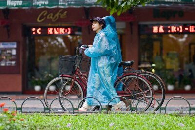Rain showers were frequent during our stay in Hanoi -- but scooter and bicycle riders are always prepared