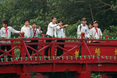 Students on the 'Sunbeam bridge' across Hoan Kiem Lake