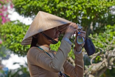 Vietnamese tourists photo op at Phuc Kien Assembly Hall. This is the guide taking a group photo.