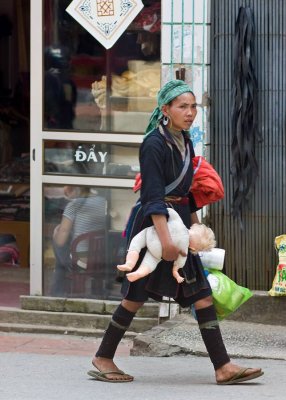 This woman carried the doll of a white child as she made her rounds about town