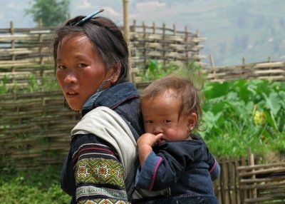 Black Hmong mother and child