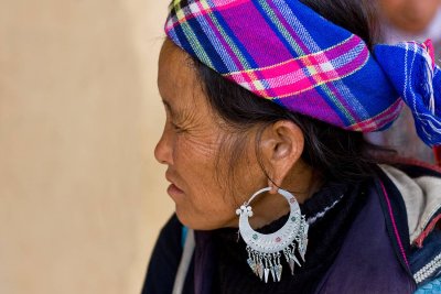Hmong woman with elaborate silver earrings