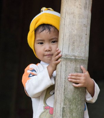 Northern Vietnam: this young boy stopped his play to watch the strangers go by