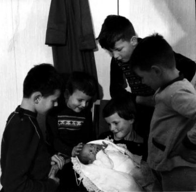 Baby Jacqueline adored by her sister and brothers
