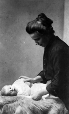 Baby Antoon Leferink in the hands of his mother Elisabeth