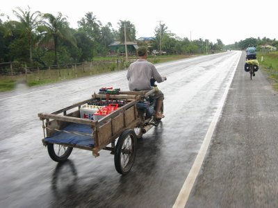 The battery delivery guy- many homes in rural Cambodia don't have electricity, so they use car batteries