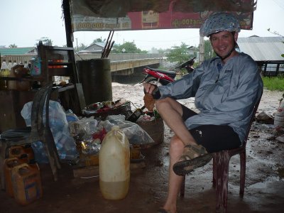 Waiting out the rain.  Yes, that is a showercap on my helmet.