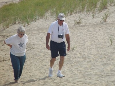 RITA AND KENNY TRUDGING THROUGH THE SAND