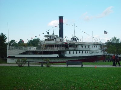 THIS WAS THE FAMOUS RESTORED STEAMBOAT THE TICONDEROGA-IT TOOK YEARS TO RESTORE AND WAS MOVED TO THE SITE ON RAILROAD CARS