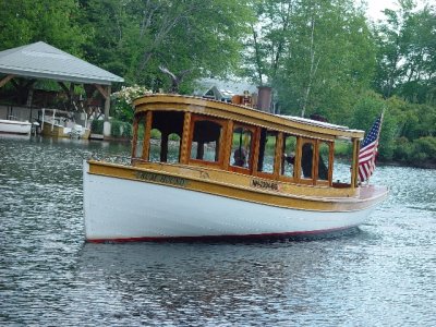 THIS WAS AN ANTIQUE STEAM POWERED TOUR BOAT