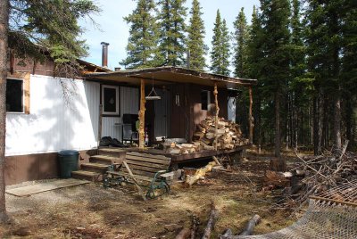 ANNE, TODD, GRACE AND ROSE ALL LIVE IN THIS TRAILER HEATED WITH WOOD BUT ARE BUILDING A NEW HOUSE THIS SUMMER