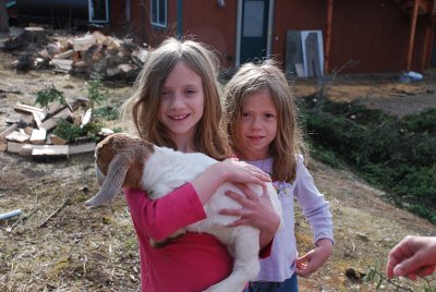 GRACE IN THE FRONT WITH HER SISTER ROSE AND A BABY GOAT