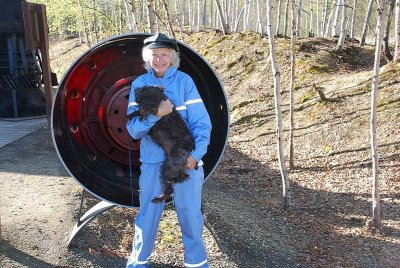 SARA AND CHARLIE IN FRONT OF A SECTION OF THE PIPELINE