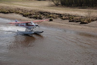 OUR TRIP STARTED WITH A BUSH PILOT TAKING OFF  AND LANDING ALONG SIDE THE BOAT