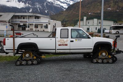 AN EXAMPLE OF ALASKAN INGENUITY-SNOW TRACKS ON A PICKUP