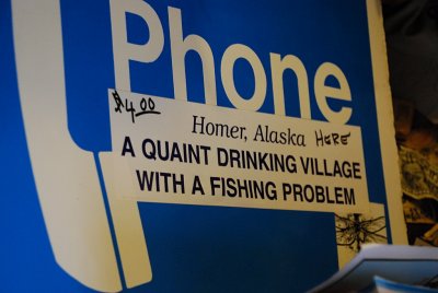 THIS SIGN DESCRIBES HOMER, ALASKA