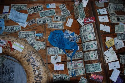 EVERY INCH OF THE WALLS AND CEILINGS OF THE SALTY DOG ARE COVERED WITH DEFILED CURRENCY WITH AN OCCASIONAL BRA OR PANTY..
