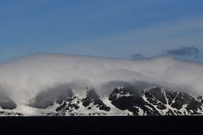 Cloud covered mountains.