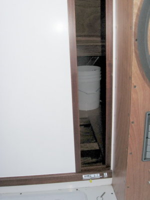 Starboard side of sliding door, open, with latch at lower right side.