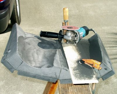 Carving setup; minicell clamped to stool; right angle grinder.