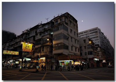 full moon and an old corner house