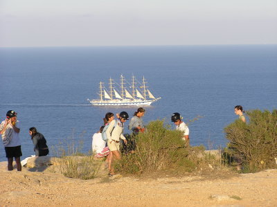 Visitors 'enthralled' by the majesty of the world's largest cutter as she quietly passes La Mola in evening sunlight