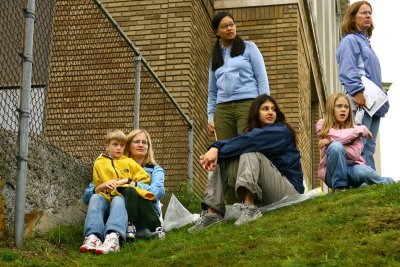 sheila, amanda, annette and matthew relaxing while i race