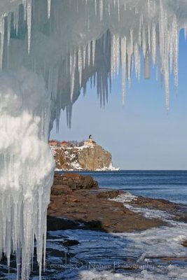 Split Rock Lighthouse framed by icicles