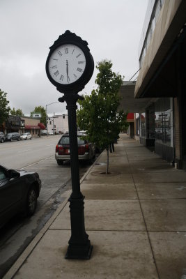 Outside there's a clock on the street.
