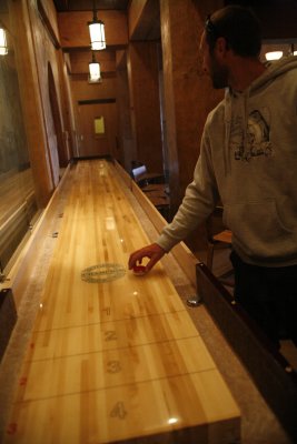 Ronnie is really taken with the shuffle board.