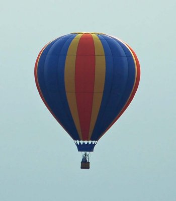 Neighbouring balloon trough a slight morning fog