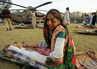 An injured Kashmiri earthquake victim cries as she waits to be transported to an Islamabad hospital.