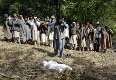 Villagers pray during the funeral