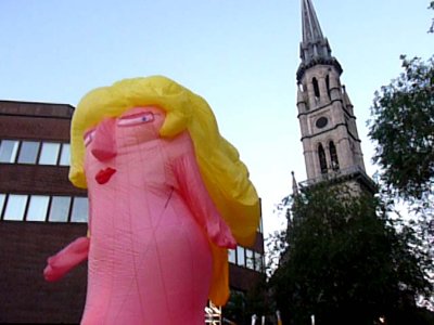 Here is this inflatable mascot again (Ill call her Pinkie for short) with the Church of Saint-Jacques in the background.