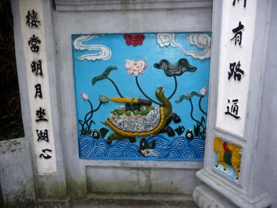 The other mural is a depiction of the Golden Turtle God with the magic sword based on the legend of Hoan Kiem Lake.