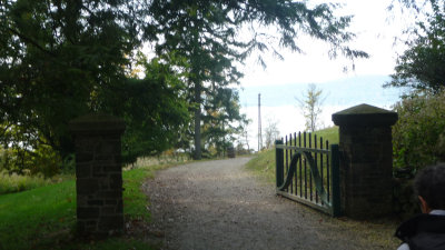 Entrance and gate to Sunnyside with the Hudson River in the background.
