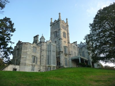 Rear view and west faade of the mansion from the lawn below with its imposing Gothic Revival tower.