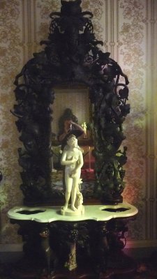 Mirror and marble sculpture in the Front Hallway.  Most of the mirrors in the house are original.