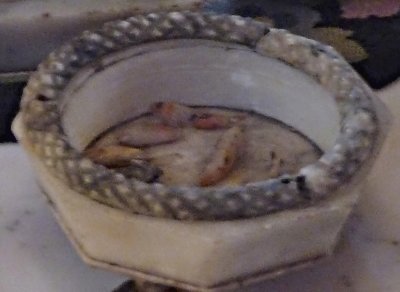 This bowl on the table with the fish inside is an original piece collected by Adelicia and made out of alabaster.