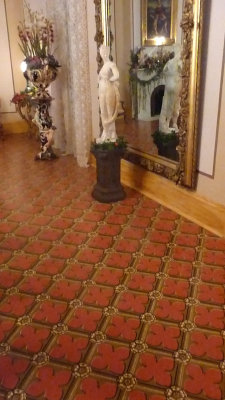 The flooring in the Formal Dining Room resembles the linoleum that we use today. The wood in this room was oak faux-painted.