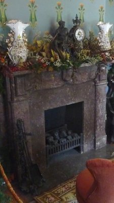 View of the fireplace made of local Tennessee Chaplain marble.  Every mantelpiece at Belmont Mansion has a clock on it.