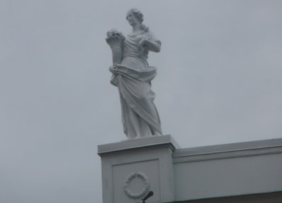 Ancient-looking statuary also adorns the top of Belmont Mansion such as this statue on the left.