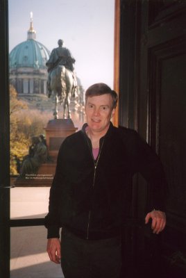 Me inside the Alte National Gallery with the statue of Friedrich Wilhelm IV seen through the window.